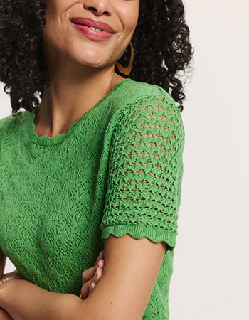 Duurzame Tranquillo trui met verfijnd opengewerkt breiwerk.