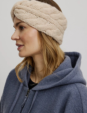 Deze wollen haarband van Tranquillo met twist en zachte fleece voering houdt je 