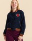 Model draagt Lalamour Billie denim bomberjack met rood hart borduursel