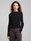 Zwarte rib top van Dedicated met mock neck en babylock afwerking.